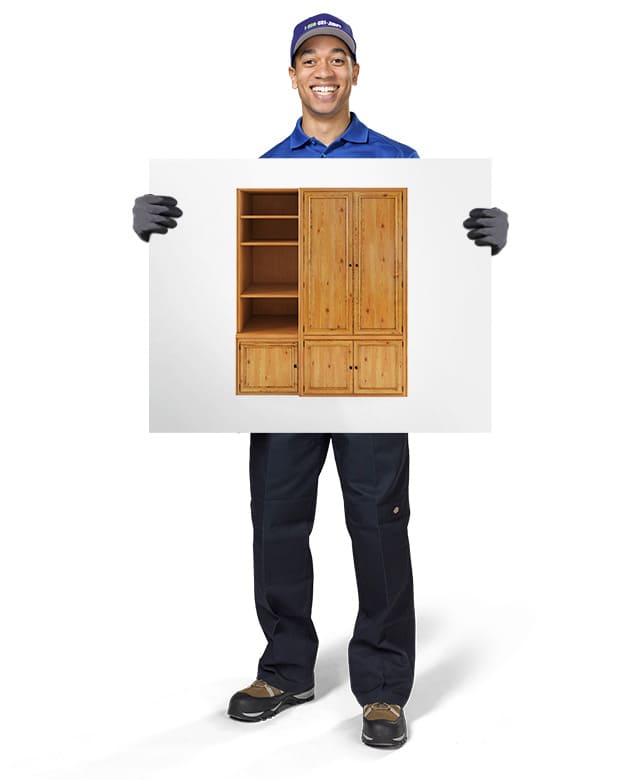 1-800-GOT-JUNK? Truck Team Member holding an image of a cabinet