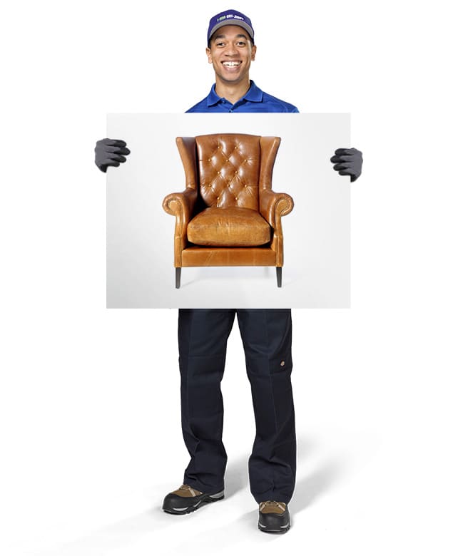 1-800-GOT-JUNK? Truck Team Member holding an image of a chair