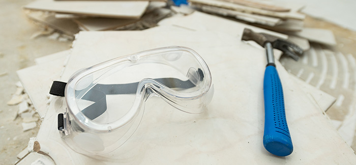 Safety tools used to remove cabinets from kitchen walls.
