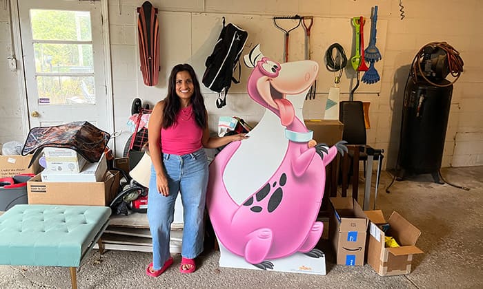 Dina Younis in her garage with some weird thrift finds.