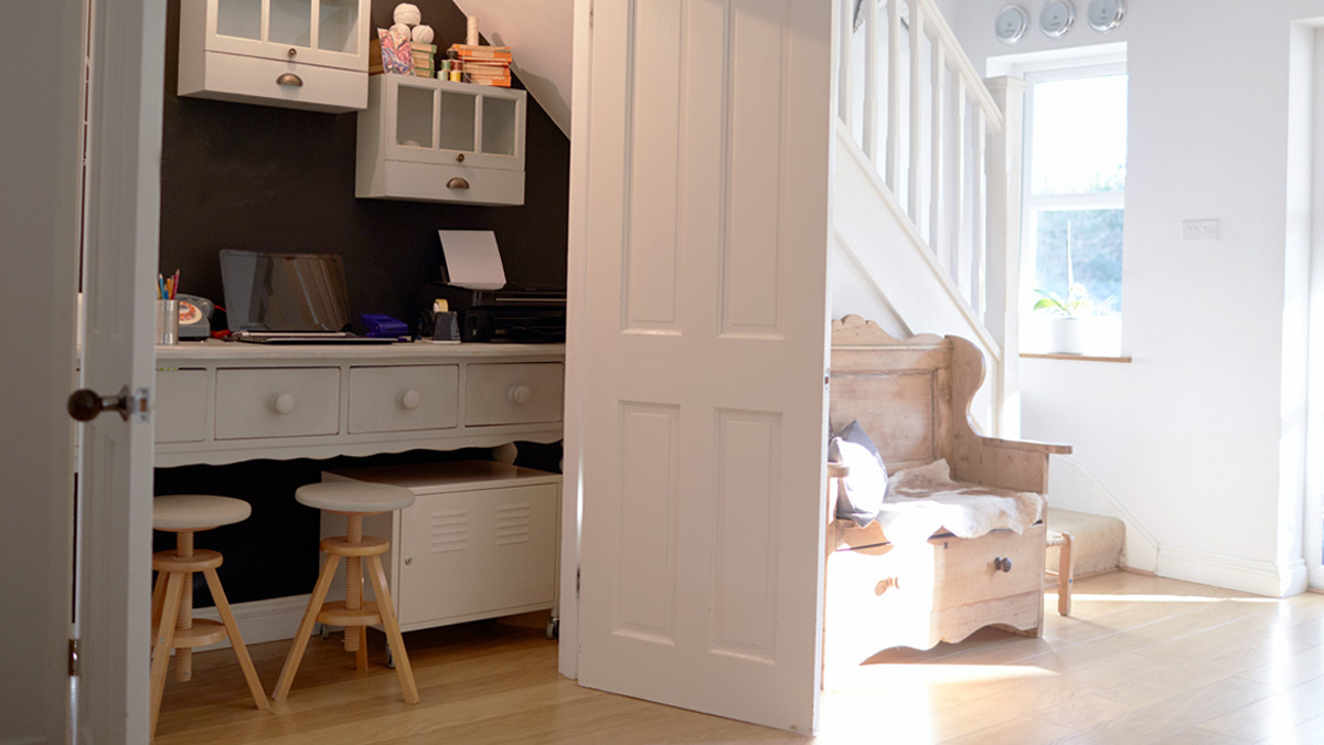 White closet office space with doors